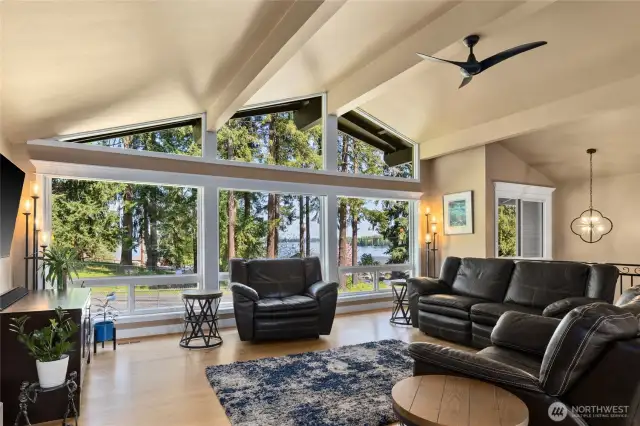 Your Mid Century Modern Home with vaulted wood beam ceilings. LOTS of natural light and those Lake front views!!!!