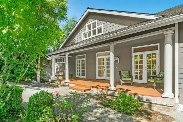 Expansive covered front porch provides room for relaxation in any weather