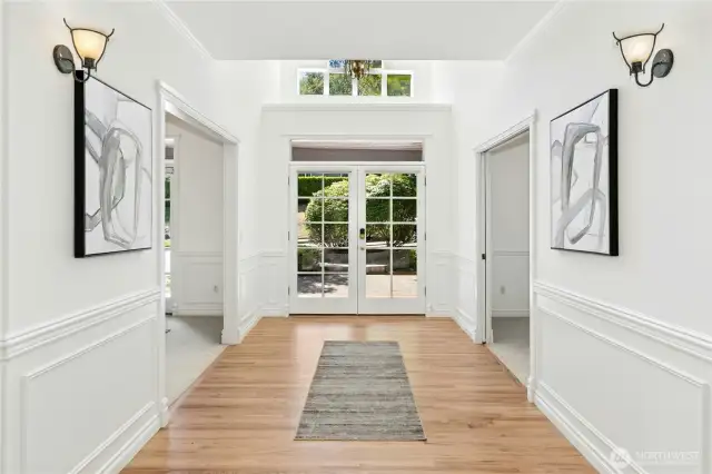 Foyer opens to dining room on one side and home office on the other.