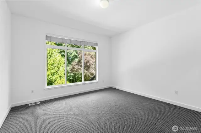 One of three lower level bedrooms.  All have attached full bathrooms.