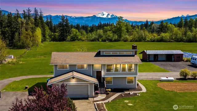 Whether you're enjoying morning coffee in the sunroom, sharing meals in the dining room, or cooking with a view in the kitchen, nature’s beauty is always front and center.