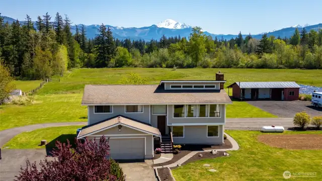 Whether you're enjoying morning coffee in the sunroom, sharing meals in the dining room, or cooking with a view in the kitchen, nature’s beauty is always front and center.
