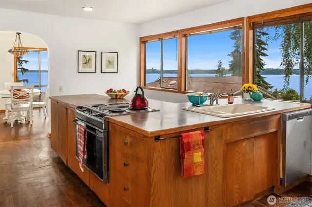 Kitchen is also light and bright and enhanced by the views of the sound. Fresh paint in this room.