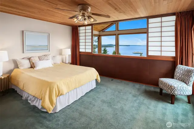 Primary suite with bird's eye views overlooks the living room. Shoji screens and drapes provide privacy when desired. This room has a fireplace, too.