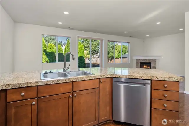 Ample counterspace overlooking dining and living rooms