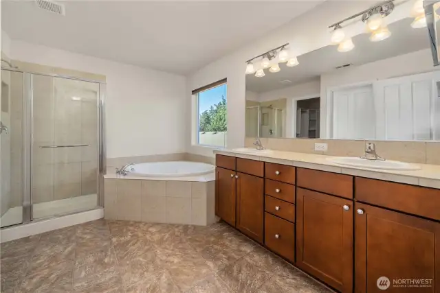 Large primary bathroom with natural light