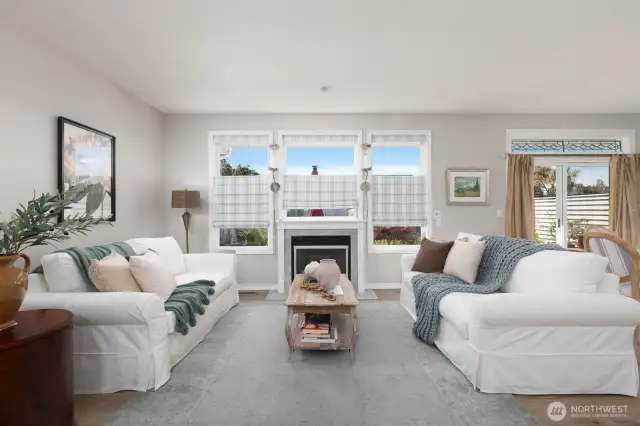 BEAUTIFUL LIVING ROOM WITH WALL OF WINDOWS