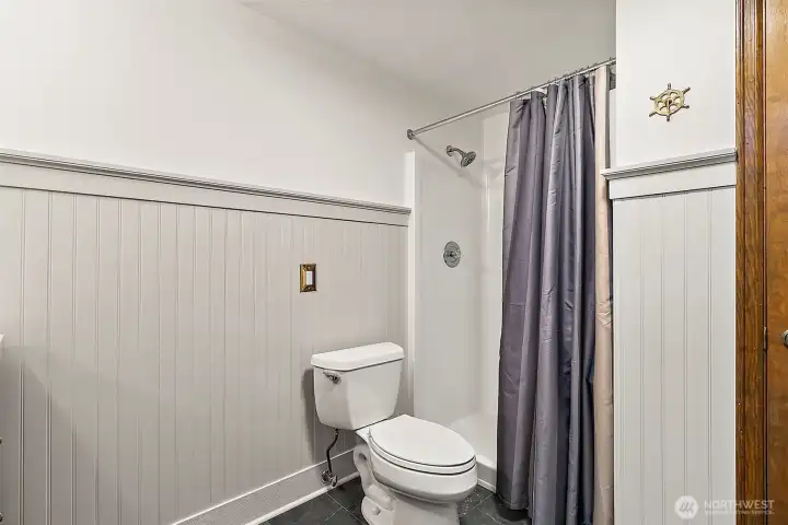 Convenient walk-in shower in the 3/4 bath downstairs.