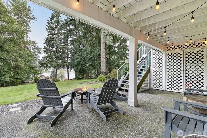 Lower level patio with direct access to the lake.  This property is completely fenced and private.
