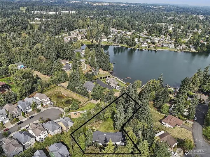 An exceptional location just steps from Lake Geneva.  This is a rough outline of the property and not the exact property lines.  This gorgeous home is perfectly nestled on a sprawling, park-like property, surrounded by mature trees, lush landscaping, and expansive lawns. Offering both beauty and function, it’s a private retreat designed for comfort, relaxation and unforgettable gatherings.