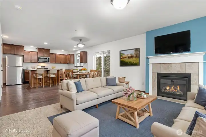 Open concept great room, perfect for living room, dining space, and kitchen. Virtually staged.