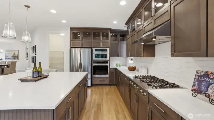 Six-burner cooktop with hood and a microwave that doubles as an oven/air fryer for all your cooking needs