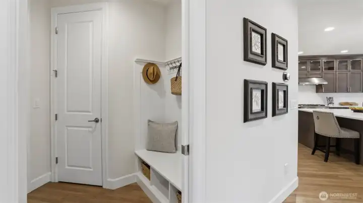 Mud room off the tandem three-car garage. The perfect, organized area for coats, shoes, and bags.