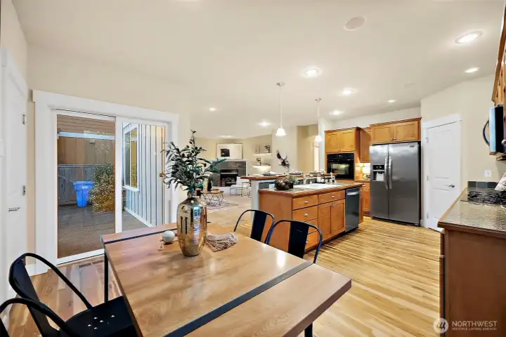 Easy flow from dining to kitchen. Access to backyard for summer BBQ season. Entertain effortless with the open concept.