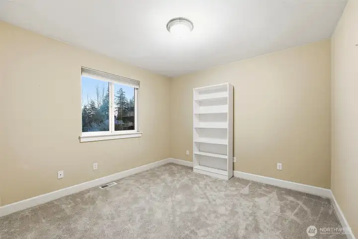 Bedroom 2 upstairs with wall-to-wall carpeted flooring.