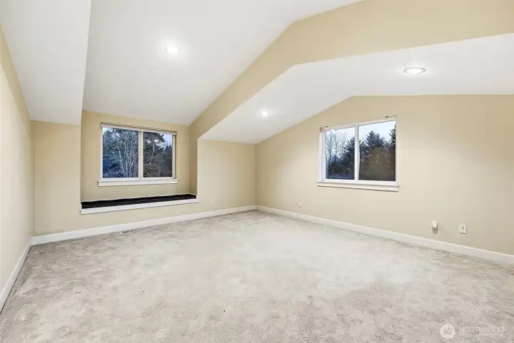 Large upstairs bonus room above garage.