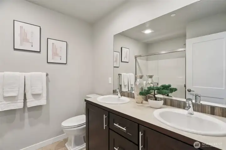 Double sink in the primary bathroom. Double sink in the primary bathroom.