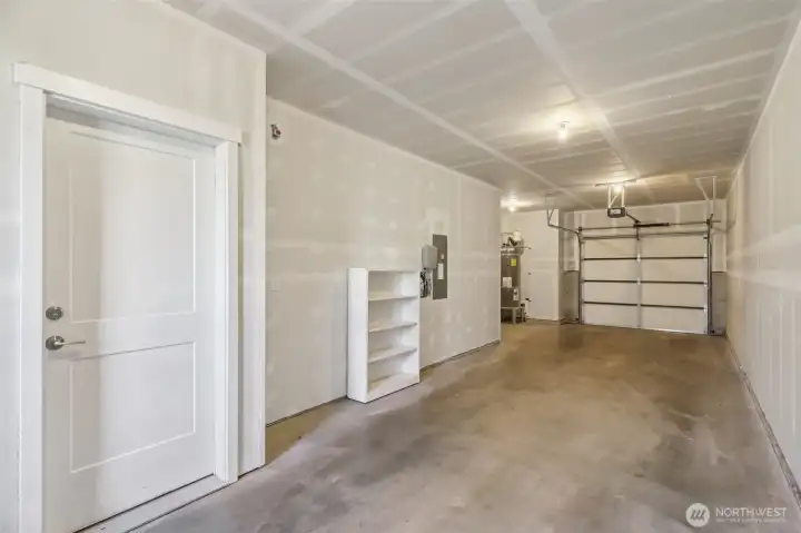two-car tandem garage accommodates two vehicles and additional storage space. two-car tandem garage accommodates two vehicles and additional storage space.