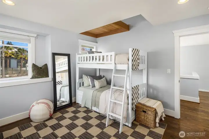 First upstairs bedroom, with loft + corner window with bench; and peek-a-boo views of Mt. Rainier!