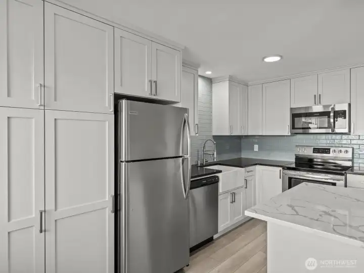 Built in pantry cabinets provide additional space for all of your cooking and baking needs.