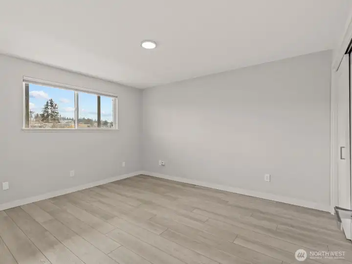 Across the hall is the large bedroom.