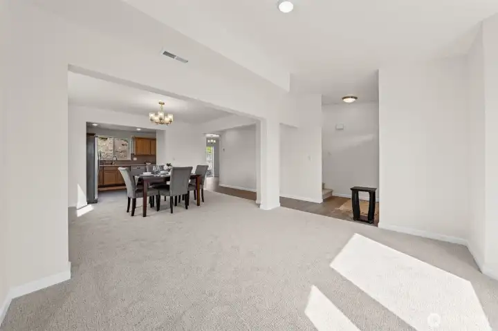 Formal living room transitions to the formal dining room