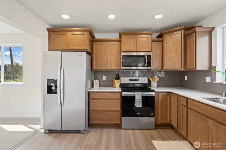 Brand new stainless steel appliances.