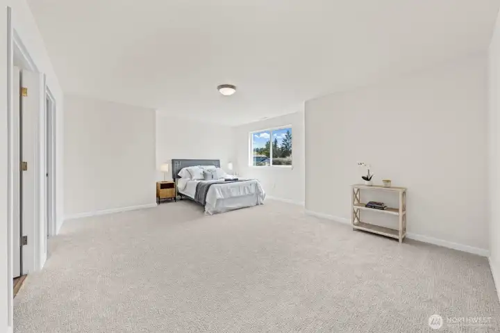Oversized primary bedroom made for an oasis, with views all the way to Tacoma.