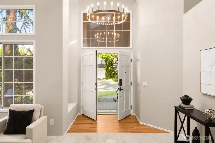 Grand foyer with soaring cathedral ceilings and new light fixtures