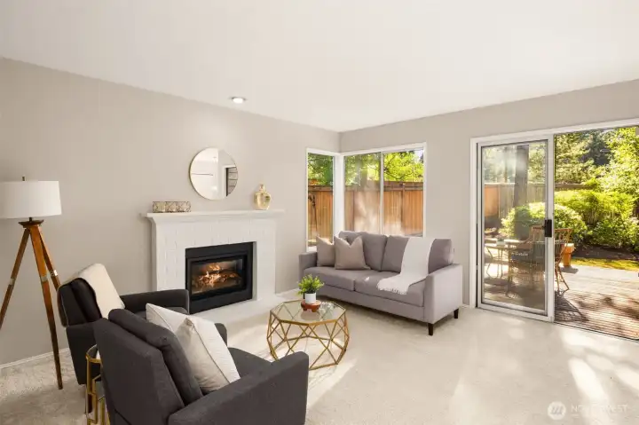Family room features a gas fireplace and plenty of natural light