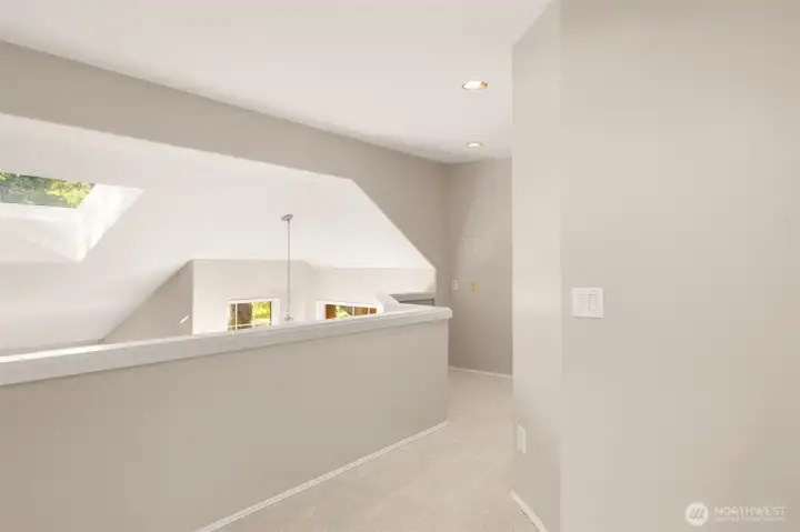 A view of the hallway plus upper level loft