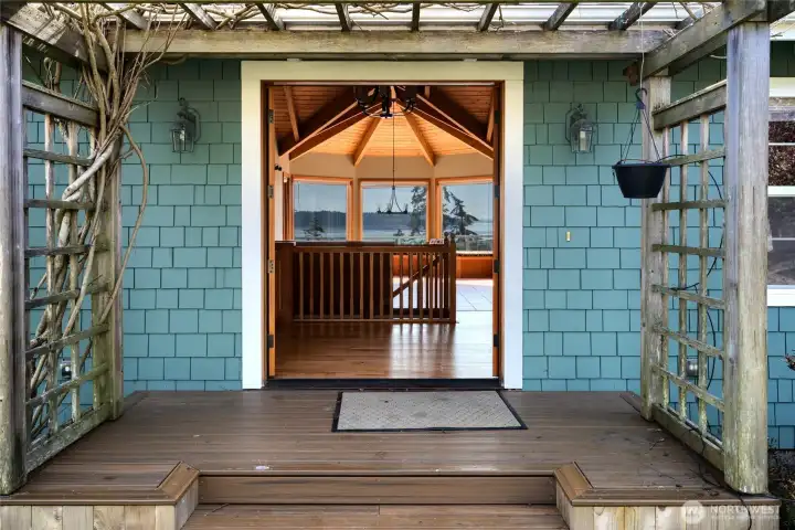 Inviting arbor trellis with growing clematis at entrance