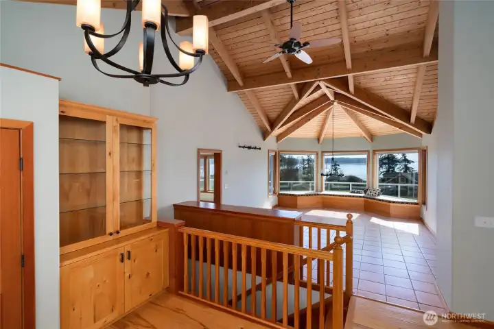 Entrance foyer with built-in cabinets and hickory floors