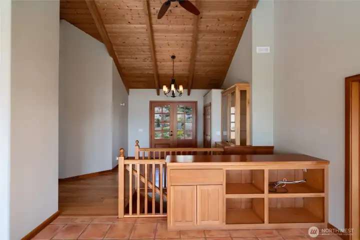 From dining room or sitting area facing entrance foyer includes built-in shelves