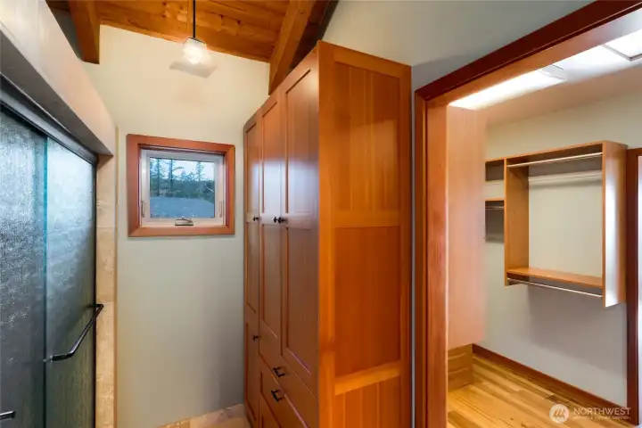 Primary bath with beautiful built-in cabinets and walk-in shower