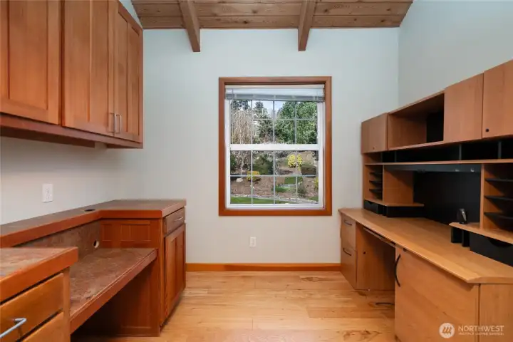 office with built-in cabinets and desk