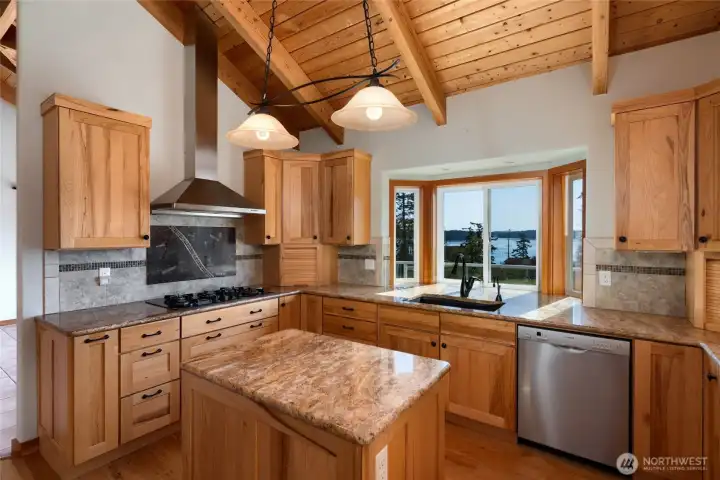 Remodeled custom kitchen with granite counters, hickory cabinets and amazing view of Similk Bay