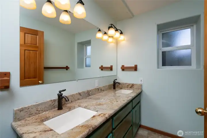 Lower level guest bath has double vanity