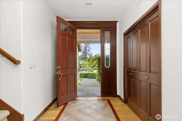 Front Door leads into a tiled entryway with a double-door coat closet with plenty of storage space.