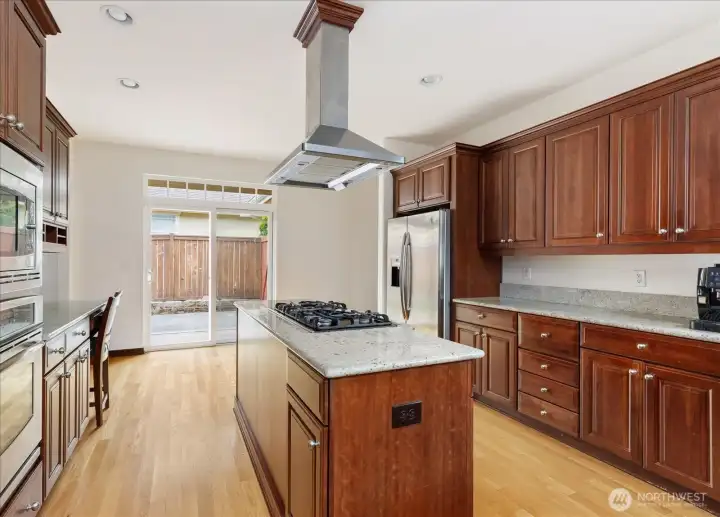 Cook's Kitchen has plenty of countertop space, and notice the stainless steel double ovens on the left.