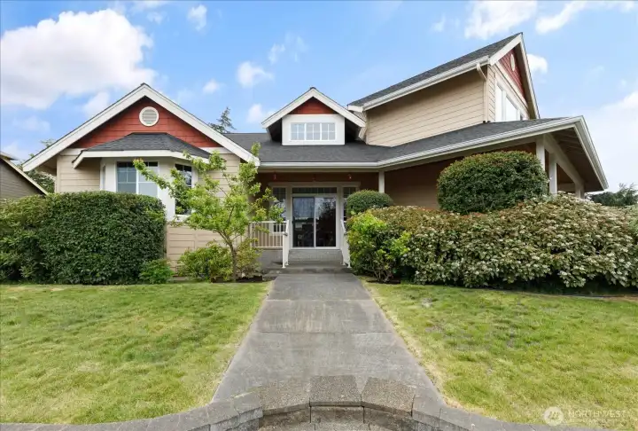 Eastside of the home with one of the side entries into the spacious home.