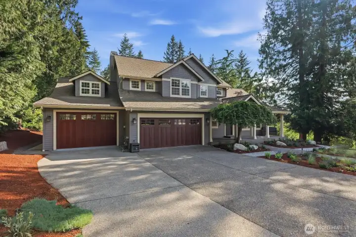 Beautifully updated bathrooms, a fully finished oversized 3-car garage with ample storage and rear garage door, a low-traffic location that offers both privacy and convenience and nearby excellent Lake Washington schools.