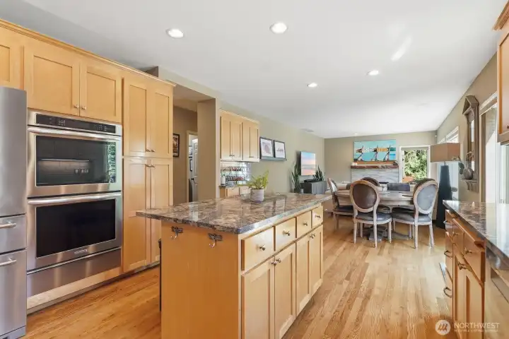 Slab Granite Kitchen Countertops w/ Maple Cabinetry.