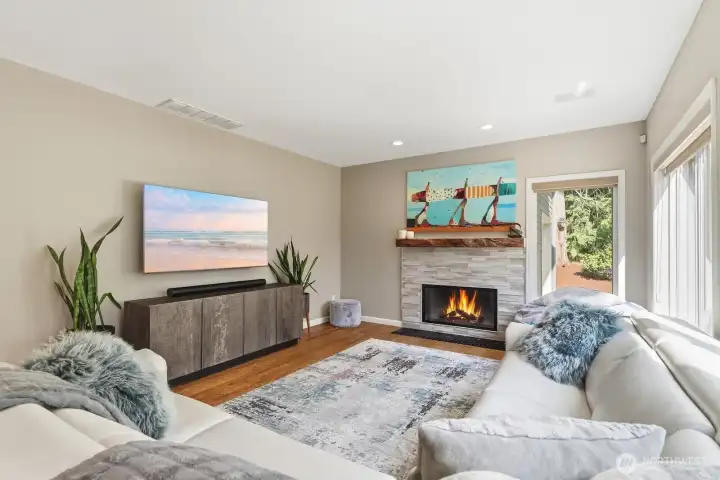 Family Room with stone surround gas fireplace.