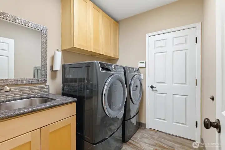 Main Floor Laundry Room; washer and dryer are included.