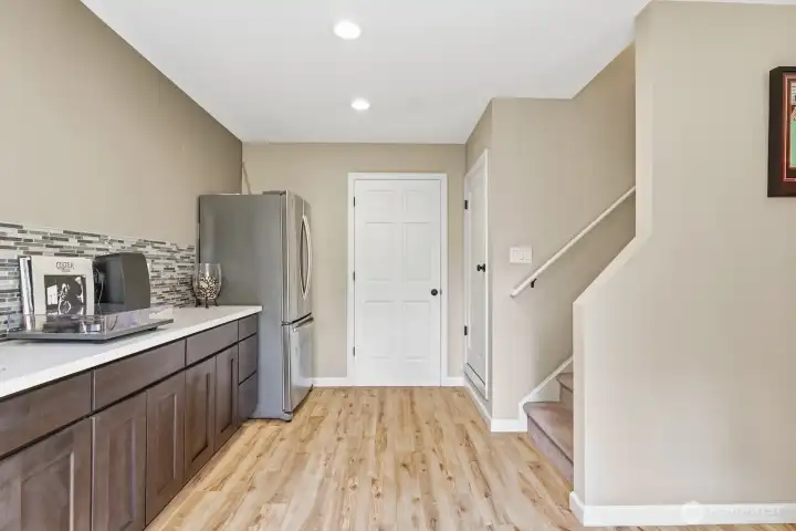 A full size refrigerator and a 144 bottle naturally temperature controlled wine storage.