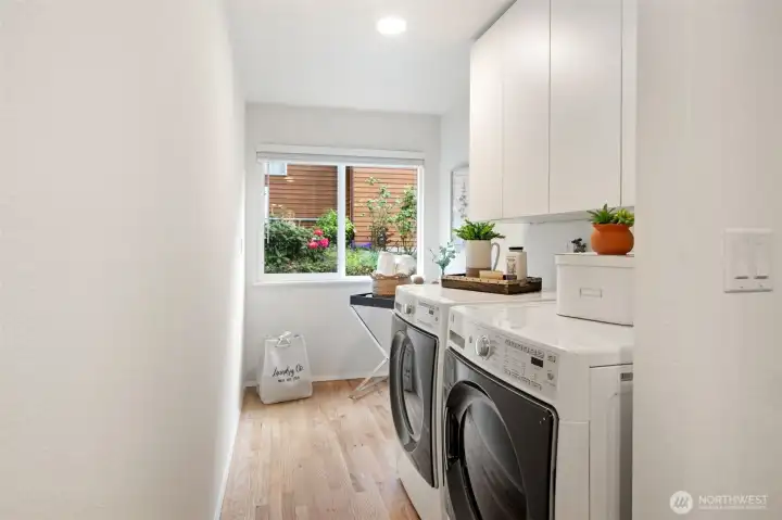 Laundry room with easy level access from kitchen and door to garage for good 'mud room' use.