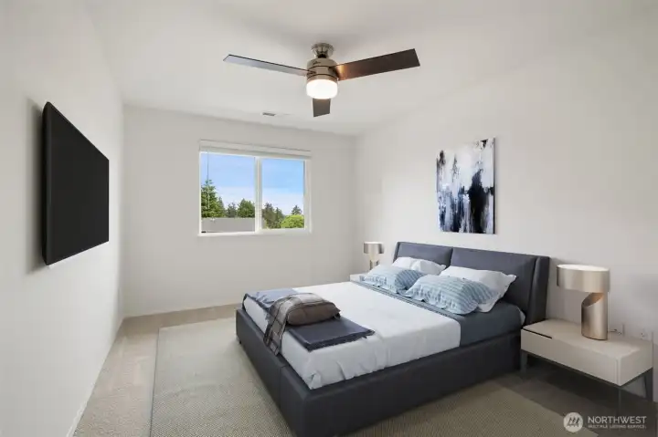 2nd level bedroom with fan and views of mountains - fresh carpets & paint. Virtually staged to show size & possibilities.