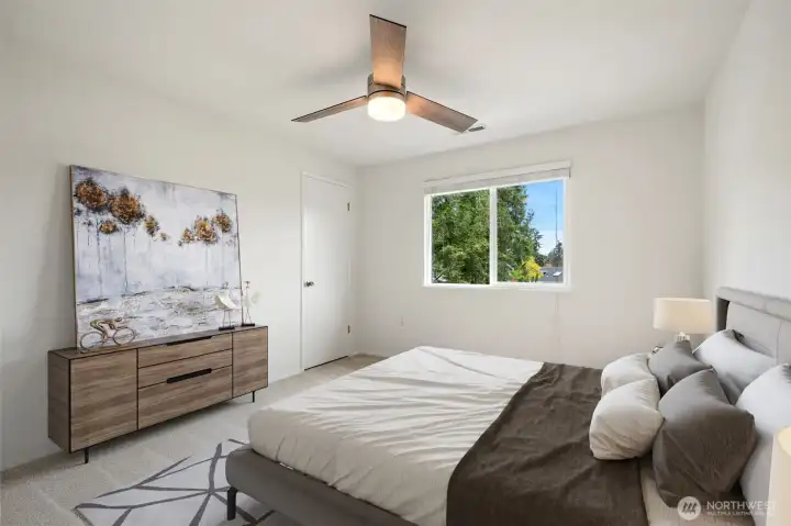 2nd level bedroom with fan and views of mountains - fresh carpets & paint. Virtually staged to show size & possibilities.