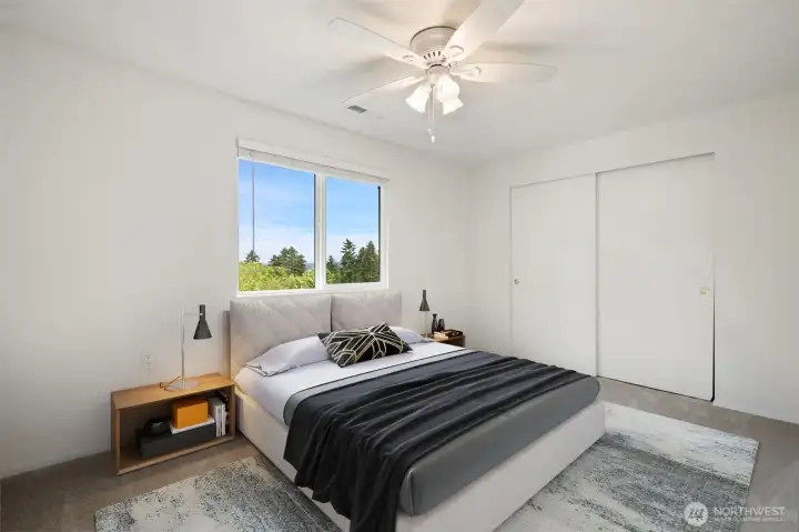 2nd level bedroom with fan and views of mountains - fresh carpets & paint. Virtually staged to show size & possibilities.